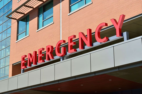 red sign over emergency room
